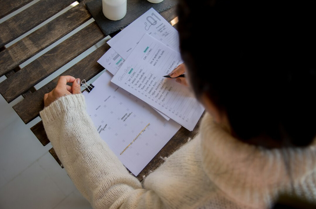 person reviewing financial papers